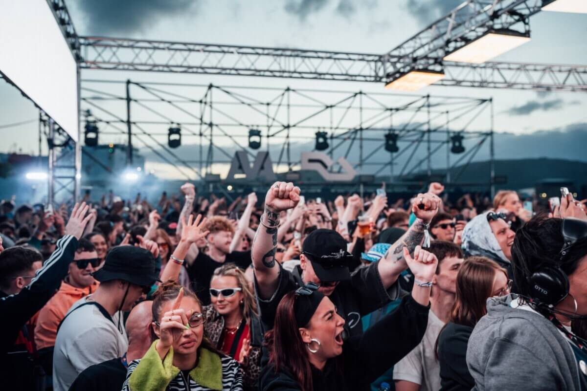 Energetic crowd at a rock concert in 2026