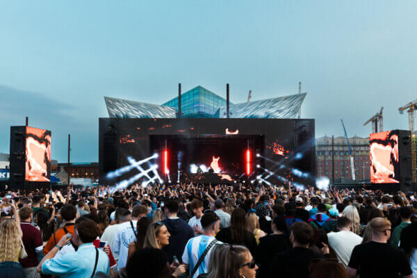 Overmono at AVA Belfast 2025 with a large crowd on Titanic Slipways