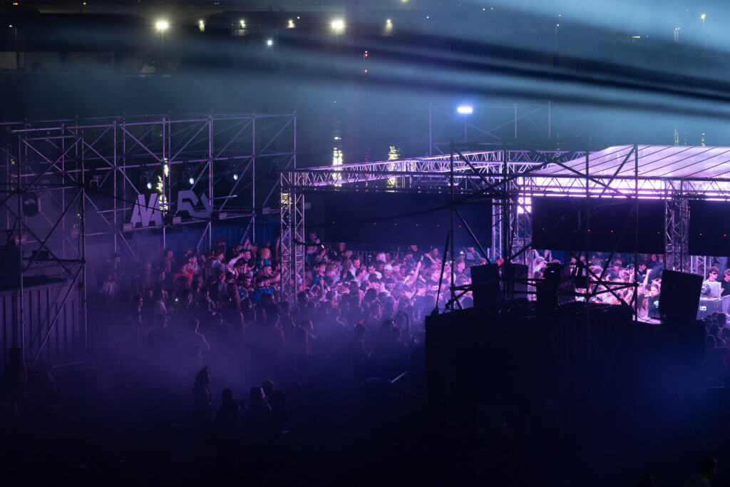 Side view of crowd photo of AVA x RA - The Dock stage at AVA Belfast 2025 at the Titanic Slipways.