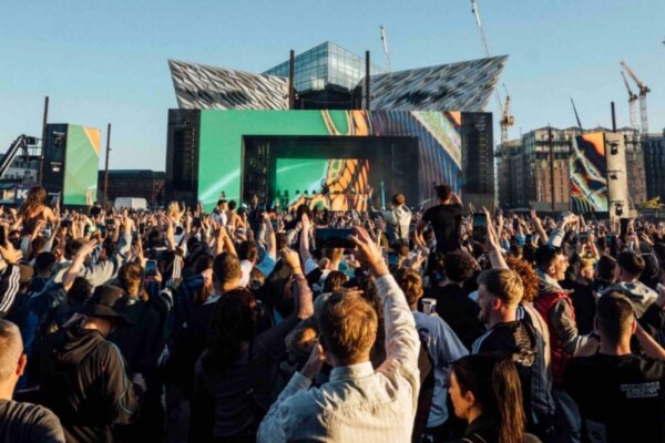Photo of the AVA Belfast 2025 main stage at Titanic Slipways with a dynamic and energetic crowd.