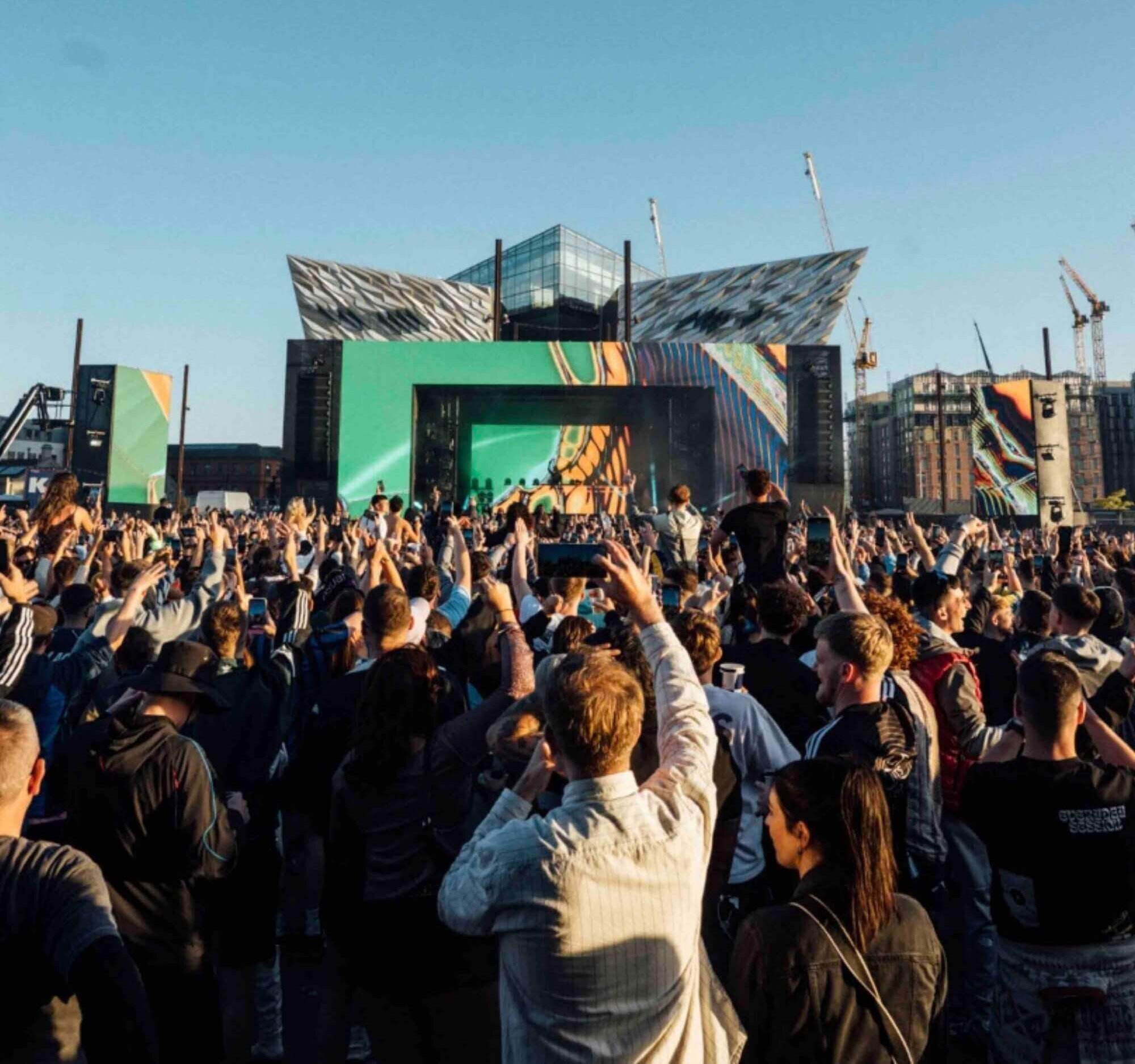 Photo of the AVA Belfast 2025 main stage at Titanic Slipways with a dynamic and energetic crowd.